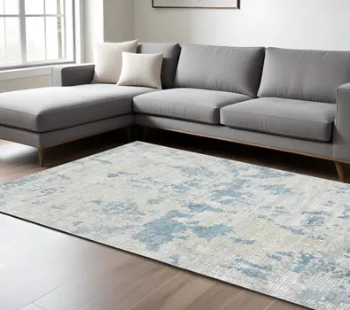 8' X 10' Ivory And Sky Blue Abstract Area Rug