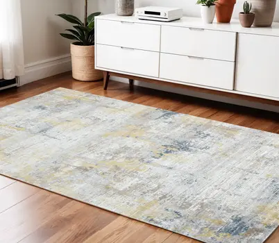 4' X 6' Gold Ivory And Blue Abstract Area Rug