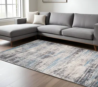 7' X 9' Blue Gray And Ivory Abstract Area Rug