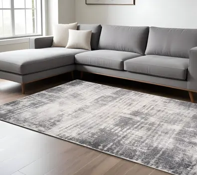 7' X 9' Cream And Gray Abstract Area Rug