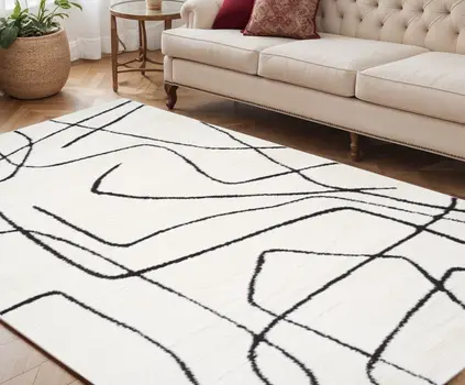 5' X 7' Ivory And Black Abstract Area Rug