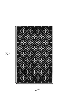 4' X 6' Black And Ivory Geometric Indoor Outdoor Area Rug