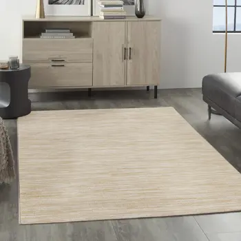 5' X 7' Ivory And Gold Abstract Indoor Outdoor Area Rug
