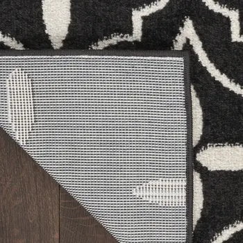 5' X 7' Black And Ivory Geometric Indoor Outdoor Area Rug