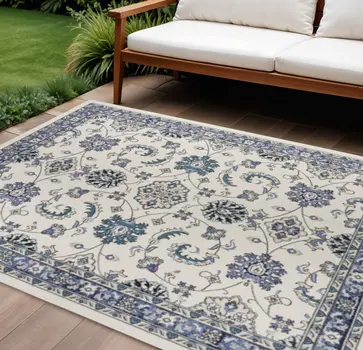 6' X 9' Ivory And Blue Floral Indoor Outdoor Area Rug
