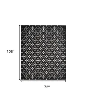 6' X 9' Black And Ivory Geometric Indoor Outdoor Area Rug