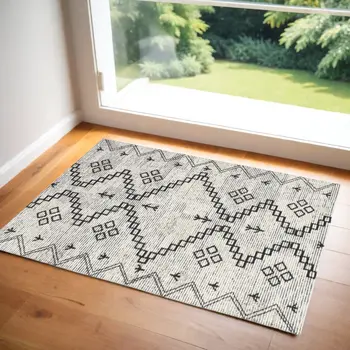 2' X 4' Ivory Geometric Worn Faded Area Rug