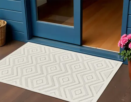 2' X 4' Ivory And White Geometric Indoor Outdoor Area Rug