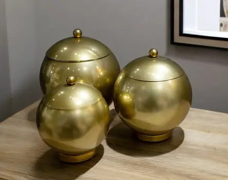 Set of Three Gold Metal Decorative Lidded Canisters