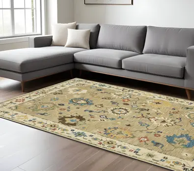 7' X 10' Beige Light Blue And Tan Oriental Area Rug With Fringe