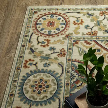 7' X 10' Ivory Blue And Orange Oriental Area Rug With Fringe