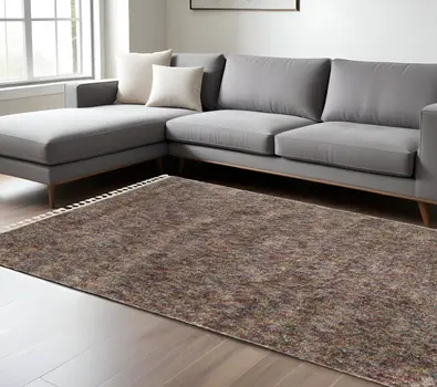7' X 10' Orange Blue And Yellow Abstract Shag Area Rug With Fringe