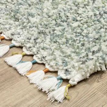 4' X 5' Light Blue And Ivory Abstract Shag Area Rug With Fringe