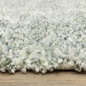 4' X 5' Light Blue And Ivory Abstract Shag Area Rug With Fringe