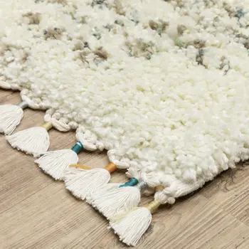 5' X 8' Ivory And Green Geometric Shag Area Rug With Fringe