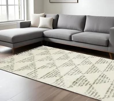 7' X 10' Ivory And Green Geometric Shag Area Rug With Fringe