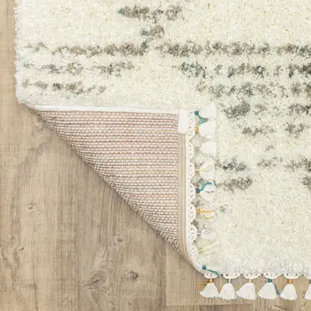 7' X 10' Ivory And Green Geometric Shag Area Rug With Fringe