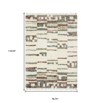 7' X 10' Tan Gray And Ivory Abstract Shag Distressed Area Rug With Fringe