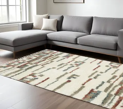 8' X 11' Tan Gray And Ivory Abstract Shag Distressed Area Rug With Fringe