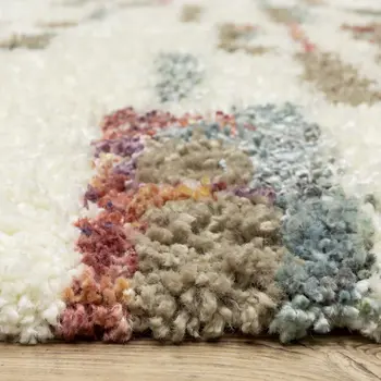 8' X 11' Tan Gray And Ivory Abstract Shag Distressed Area Rug With Fringe
