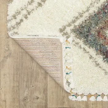 5' X 8' Ivory Red And Orange Southwestern Shag Area Rug With Fringe