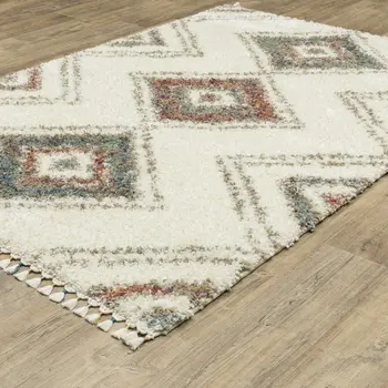 4' X 5' Ivory Red And Orange Southwestern Shag Area Rug With Fringe