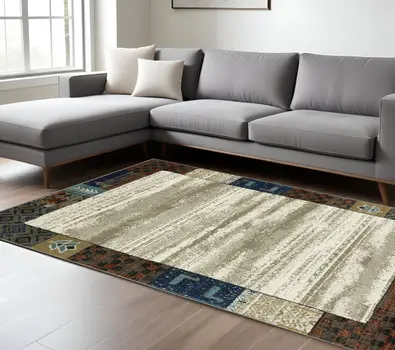 7' X 9' Ivory Tan And Blue Patchwork Area Rug