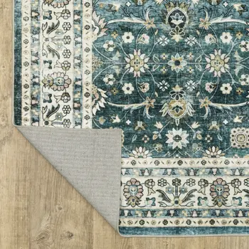 4' X 6' Teal And Ivory Oriental Distressed Area Rug