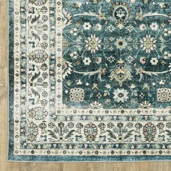 5' X 7' Teal And Ivory Oriental Distressed Area Rug