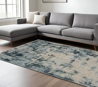 7' X 10' Beige And Blue Abstract Distressed Area Rug With Fringe