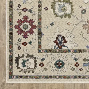 7' X 10' Ivory Blue And Light Brown Floral Area Rug With Fringe