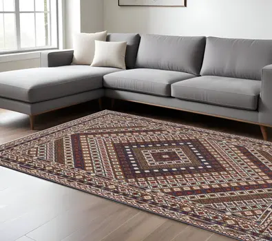 7' X 10' Ivory Red And Tan Diamond Area Rug With Fringe