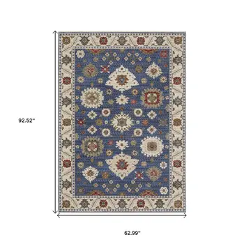 5' X 8' Blue And Ivory Floral Area Rug With Fringe