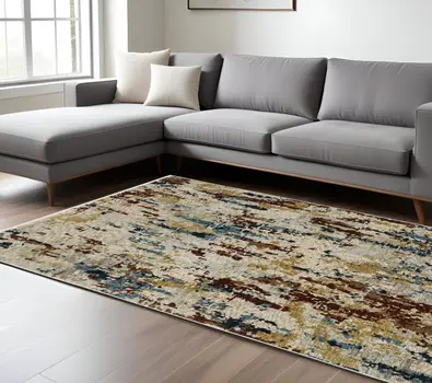 10' X 13' Beige Rust And Light Blue Abstract Distressed Area Rug With Fringe