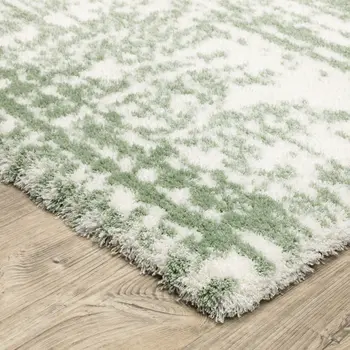 5' X 8' Green And Ivory Abstract Area Rug