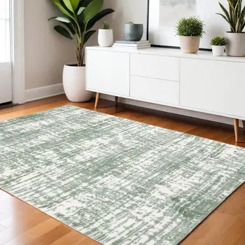 4' X 6' Green And Ivory Abstract Area Rug