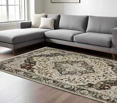 7' X 10' Ivory Brown And Red Medallion Area Rug With Fringe