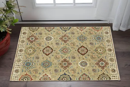 2' X 3' Tan Light Blue And Orange Floral Area Rug With Fringe