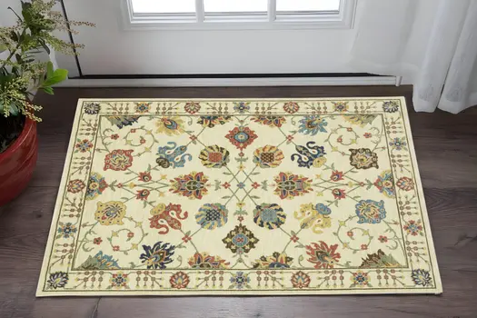 3' X 5' Ivory Yellow And Dark Orange Oriental Area Rug With Fringe