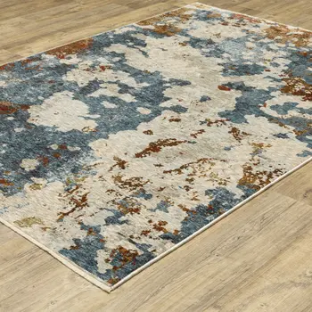 3' X 5' Beige Teal And Rust Abstract Area Rug With Fringe