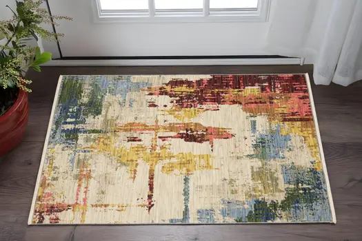 3' X 5' Beige Yellow And Orange Abstract Area Rug With Fringe