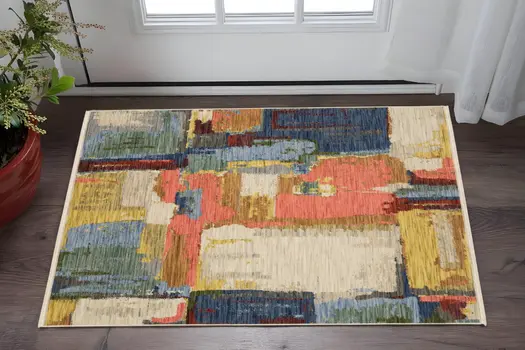 3' X 5' Beige Yellow And Pink Abstract Area Rug With Fringe