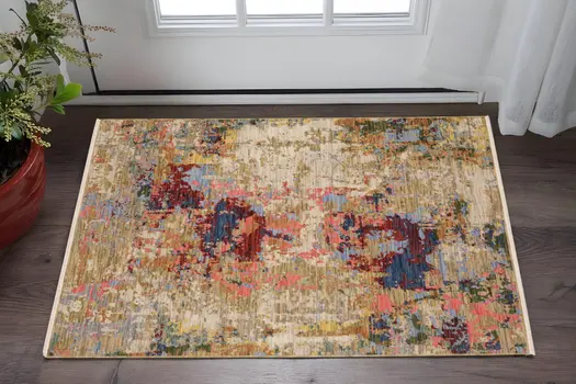 3' X 5' Beige Salmon And Yellow Abstract Area Rug With Fringe