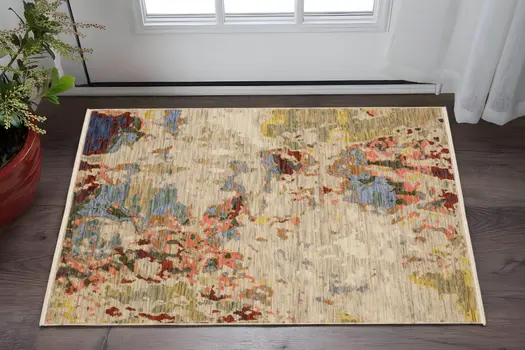 3' X 5' Beige Salmon And Yellow Abstract Area Rug With Fringe