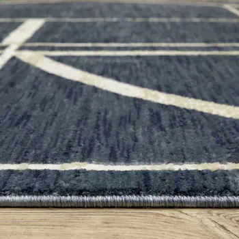 5' X 8' Blue And Ivory Geometric Area Rug