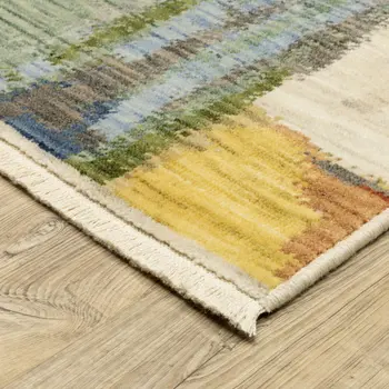 5' X 8' Beige Yellow And Salmon Abstract Area Rug With Fringe
