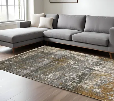 7' X 10' Gray And Gold Abstract Area Rug With Fringe