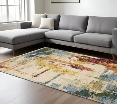 7' X 10' Beige Yellow And Salmon Abstract Area Rug With Fringe