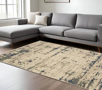 7' X 10' Beige And Green Abstract Area Rug With Fringe