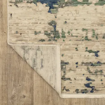 7' X 10' Beige And Green Abstract Area Rug With Fringe
